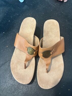 Tan Leather Thong Sandals with Decorative Medallion